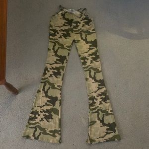 Urban Renewal, size small. Camouflage print. Color are shades of green and tan.